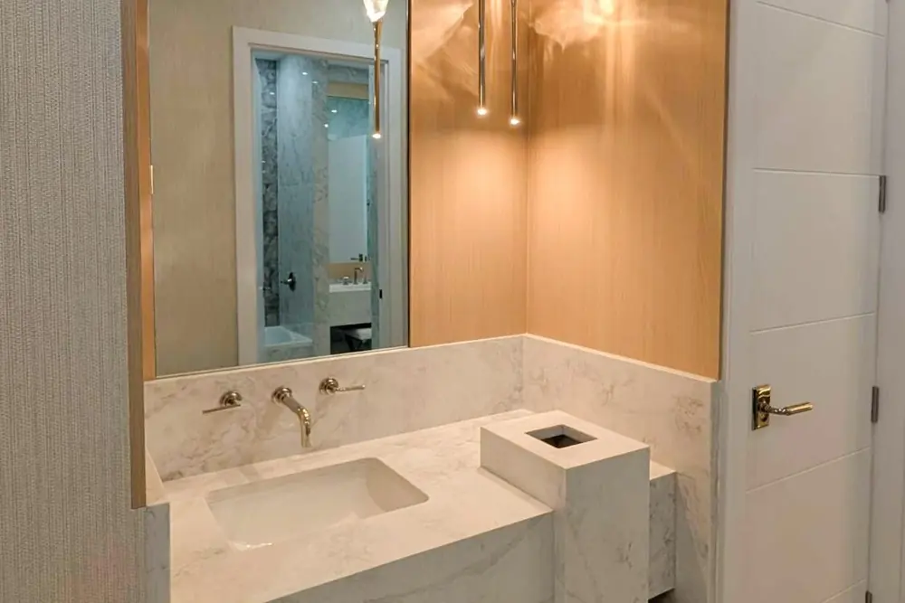 Marble vanity with pendant lighting in a Sarasota spa we built